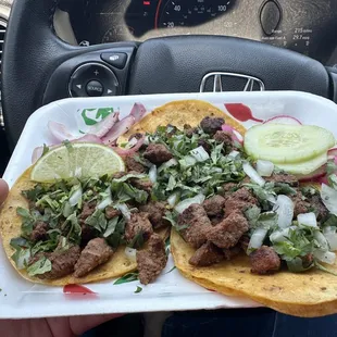 a person holding a plate of food