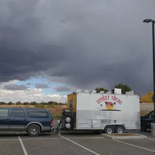 a truck and a trailer in a parking lot