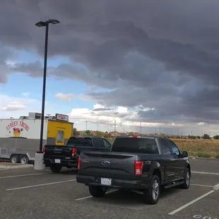 a truck and trailer in a parking lot