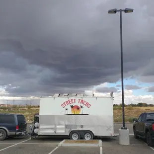 a taco truck parked in a parking lot