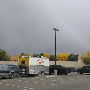 a taco truck parked in a parking lot