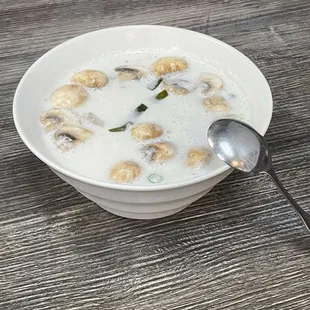 8. Tom Kha Gai, the broth is so creamy and white, showing the use of an herbal bag.