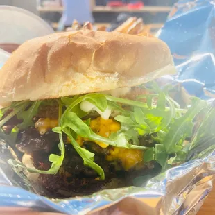 The "Green Jacket" {Fried green tomato, roasted red peppers, pimento cheese, arugula, truck-made garlic aioli}