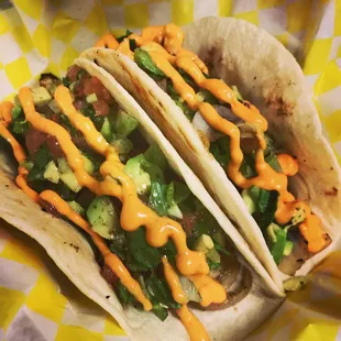 Vegan Tacos: sautéed onions &amp; mushrooms, fresh avocado &amp; jalapeños, Ohio tomato, romaine lettuce, cilantro, truck made vegan sriracha aioli