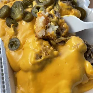 Brisket. Tots!! Yummy crispy tots, cheesy cheese (no watered down cheese here) and yummy shredded brisket with fiery jalapeños. Yas.