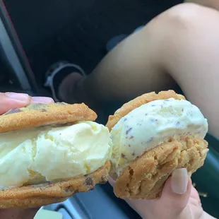 a person holding an ice cream sandwich