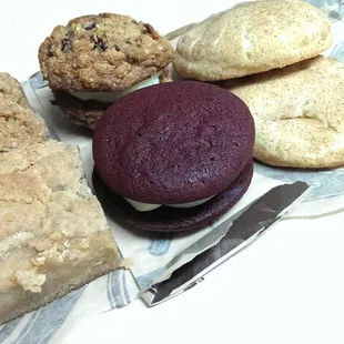 Stocking up! Snickerdoodle cookies on the right, pumpkin bar and apple bar on the left, and red velvet cookie in the middle.