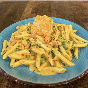 Seafood Pasta with crawfish, shrimp, creamy Alfredo sauce and baked cheese