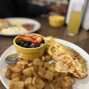 Seafood Omelette with potatoes and fruit