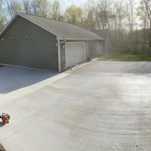 30+ yard driveway. Rebar 2&apos; on center broom finish and seal. Sawcut