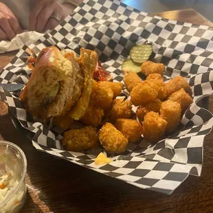 Southern Crispy Fried Chicken Sandwich with tater tots. Tots come with a delicious cheese sauce!