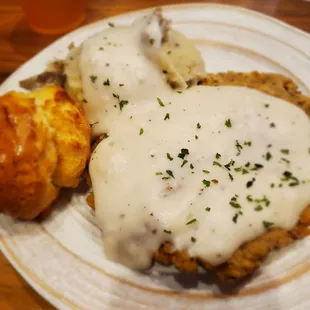 Chicken fried steak with whipped potatoes and honey biscuit