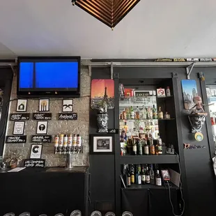 a bar with a television on the wall