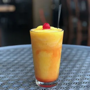 Enjoying a frozen mango daiquiri on the patio