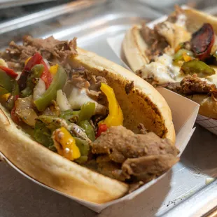 two sub sandwiches on a tray