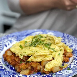 a plate of omelets and potatoes