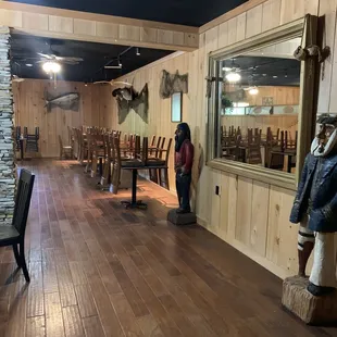 a woman standing in the dining room