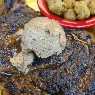 a steak with a scoop of ice cream
