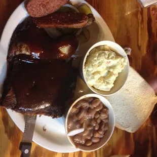 a plate of meat and beans