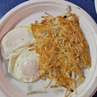 Eggs over medium y hashbrowns part of the chicken fried steak plate