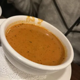 a bowl of soup on a plate