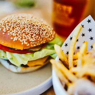 The Famous SOL Burger! Grilled Patty, Cheese, SOL Sauce, Pickles, White Onions, Lettuce &amp; Tomato. Vegetarian? Swap for an Impossible Patty!