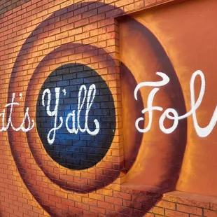 a brick wall with graffiti