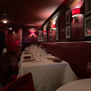 a long table with wine glasses on it