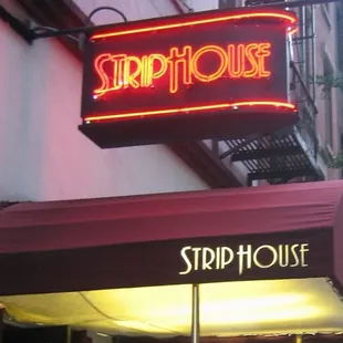 exterior:  neon sign above entrance