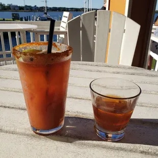 a bloody drink and a drink glass