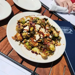 Roasted brussel sprouts with blue cheese crumbles and bacon bits