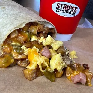 Meat lovers breakfast burrito with green chile