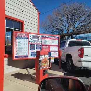 a truck parked in front of a restaurant