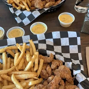 Regular and Large size GF chicken nuggets with fries and honey mustard dipping sauce.