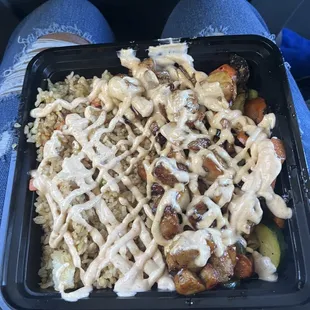 Hibachi chicken with rice, veggies, and yum yum sauce.