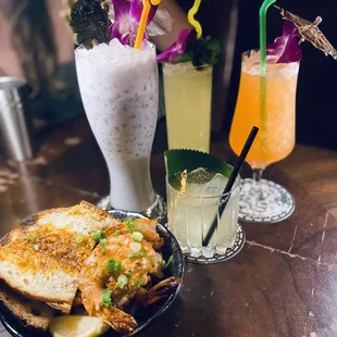 Garlic Butter Shrimp, Taro Colada (lavender) Missionary's Downfall (yellow), Birds of Paradise (orange), and The Queen's Ritual.