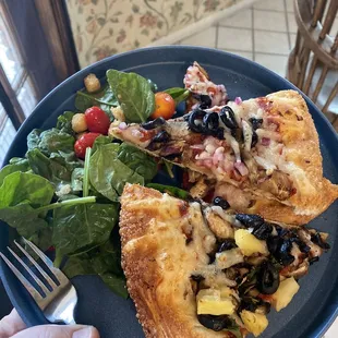 a hand holding a plate of food
