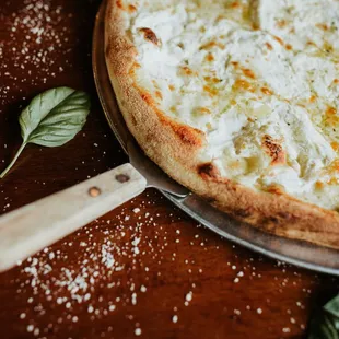 3 Cheese Bianca Pizza. Mozzarella, ricotta, asiago and olive oil base.