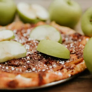apple slices on a pizza
