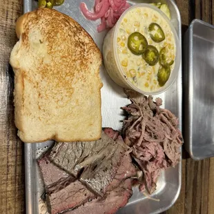 Brisket and pulled pork plate with jalapeño corn