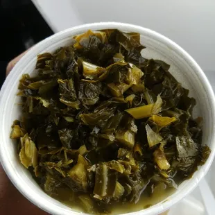 Collards.. heavy vinegar flavor.. needs salt lol...