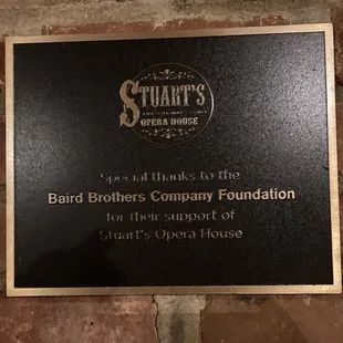 plaque on brick wall