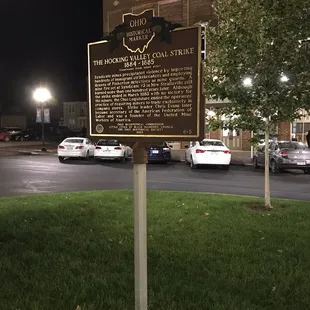 a historical plaque in front of the theater