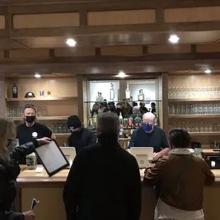 a group of people at a bar