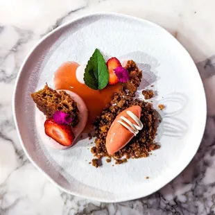 a plate of food on a marble table