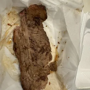 $18 for a piece of meat and one small side.  And half of it was fat.