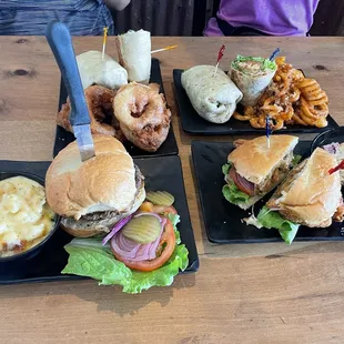 mushroom swiss burger + mac and cheese 2xchicken caesar twister wrap + onion rings &amp; curly garlic fries fried chicken sandwich + coleslaw