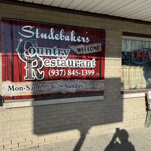 a shadow of a person on the sidewalk