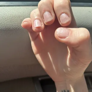 Unprofessional nail services and messy results.