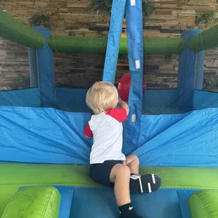 My baby boy using the bounce house they had available for us to use!
